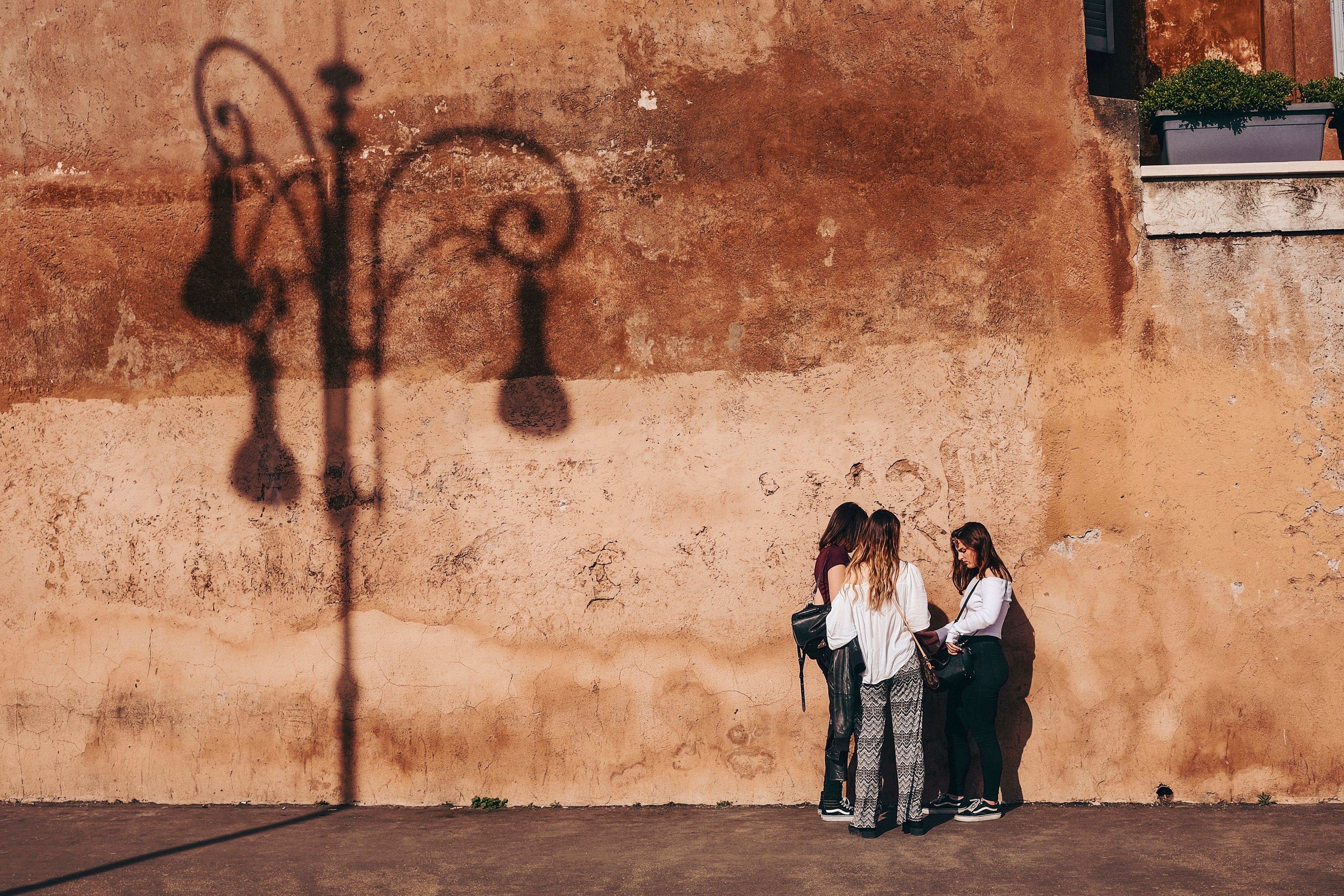 files/three-women-by-a-rustic-wall.jpg