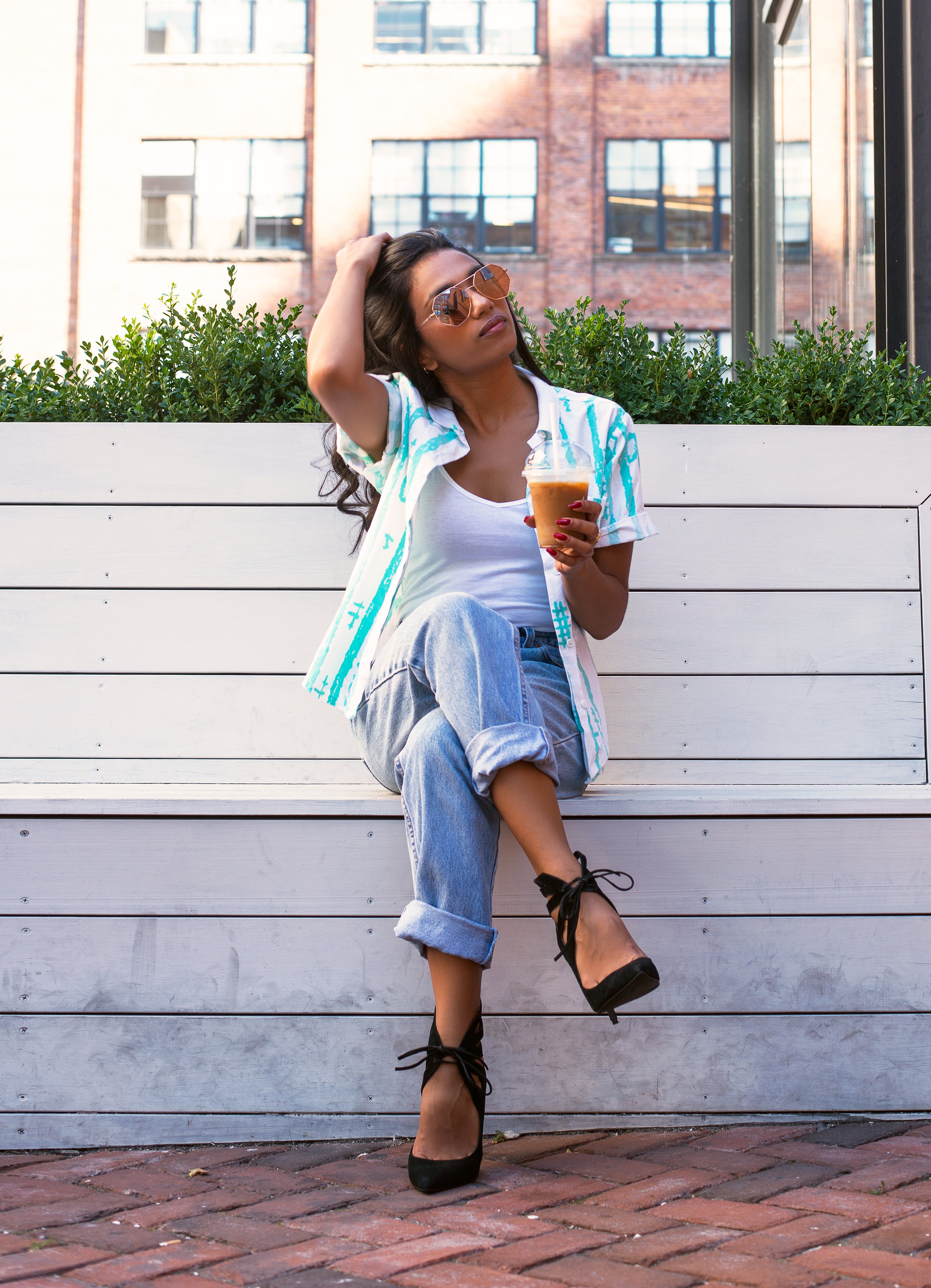 files/woman-with-coffee-runs-hands-through-hair.jpg